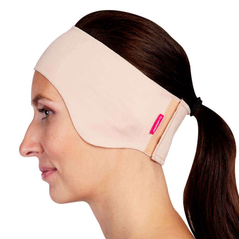 beige compression headband covering ears